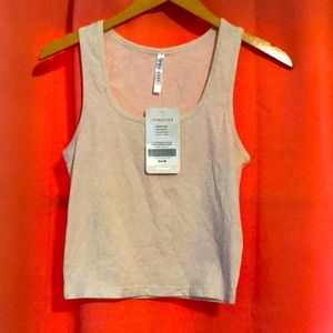 Fabletics tank top in small and cream colored